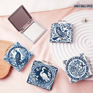 Retro style portable mirror, designed with blue and white porcelain, featuring floral, bird, peacock, and butterfly patterns, making it the perfect choice for girls' birthdays, Valentine's Day, or wedding gifts