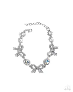 Coquette Caliber - White Rhinestone Silver Bow Bracelet - Paparazzi