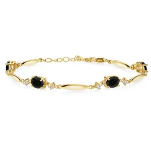 Gem Stone King 18K Yellow Gold Plated Silver Gemstone Birthstone and White Moissanite Tennis Bracelet For Women | Oval 7X5MM and 2MM | 6 Inch + 1 Inch Extender | Fine Jewelry for Her Mom Wife