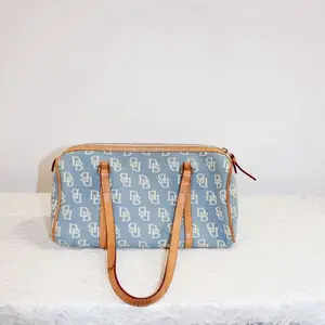 Dooney and Bourke Bag - Blue Pattern with Brown Handles and Zipper Closure