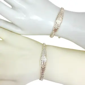 Santa Muerte bracelet with clear cubic zirconia stones made of 925 sterling silver. Elegant design for stylish wearers.
