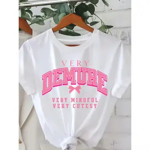 Everyday Comfort |   Women's Casual "Very Demure" Graphic Tee with Bow Detail - Soft Knit, Short Sleeve, Round Neck, Spring/Summer Fashion Top, White with Pink Print, Fitness Attire |   Bow Detail Shirt |   Nontransparent Material
