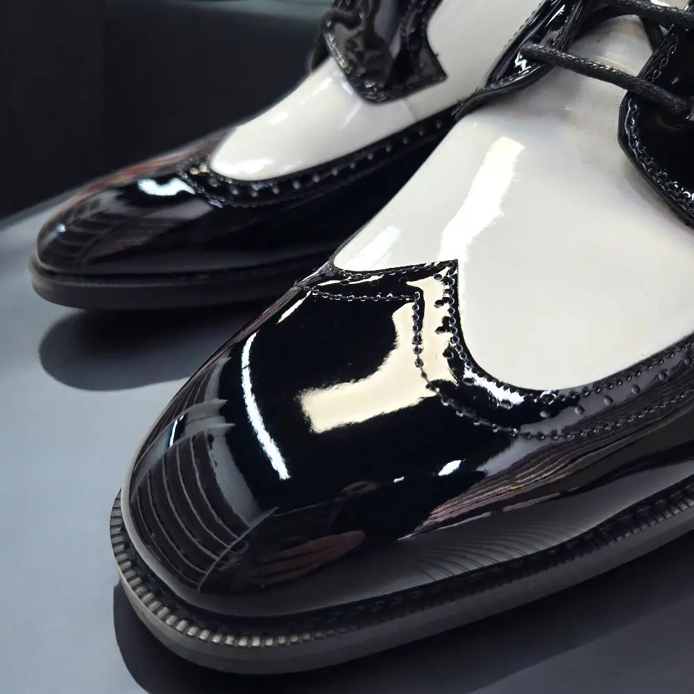 Black and White Wingtip Shoes with Black Laces and White Sole Black and White Wingtip Shoes with Black Laces and White Sole