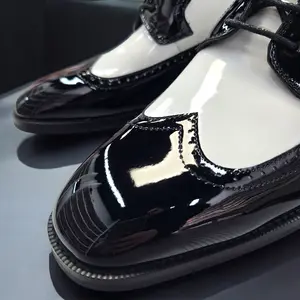 Black and White Wingtip Shoes with Black Laces and White Sole