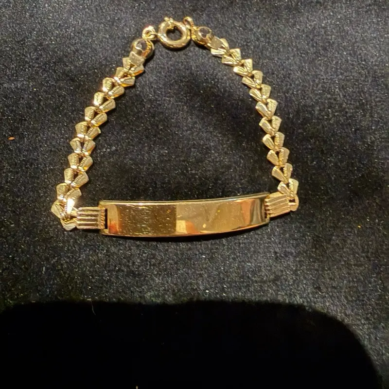 Pulsera tejido petalillo con  placa Oro 10k italiano size 7