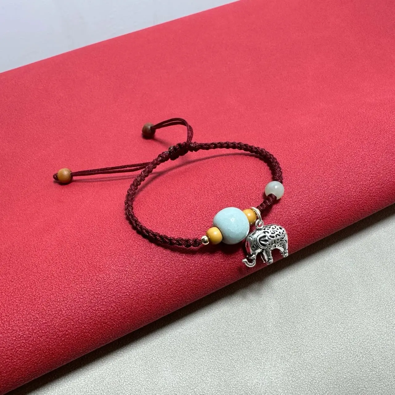 Adjustable Red String Bracelet with Celadon Bead & Silver Lucky Elephant Charm