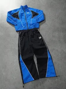 This men's two-piece tracksuit includes a turtleneck jacket and sweatpants, featuring a striking blue and black color-block design with a unique sheen. Suitable for outdoor activities and casual wear, it also makes a great holiday gift.