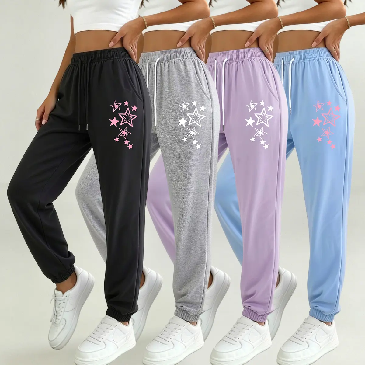 Women’s athletic pants set of 4, featuring drawstring, pockets, and an adjustable waistband—ideal for everyday wear and casual workouts.