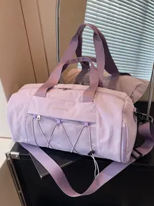 Light purple cylindrical travel bag, mesh drawstring pocket, dual handle design, adjustable shoulder strap, gentle taro color tone, large storage capacity, versatile item for sports, commuting, and outdoor activities