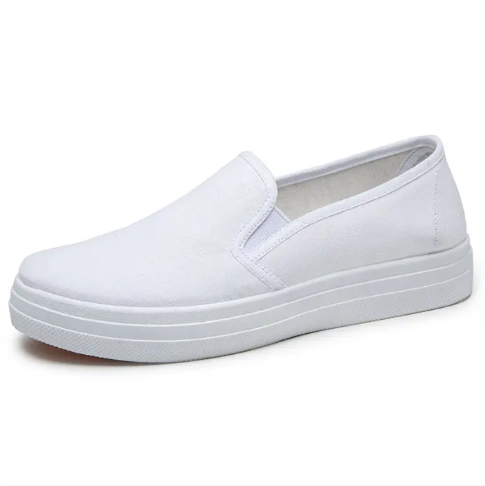 Plain white slip-on canvas shoes with layered platform soles, no laces design brings hassle-free comfy fits for daily office errands