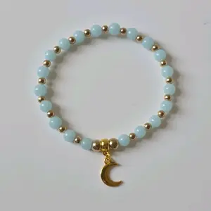 Glow in the Dark Glass Star and Moon Charm Bracelet with Gold Accents