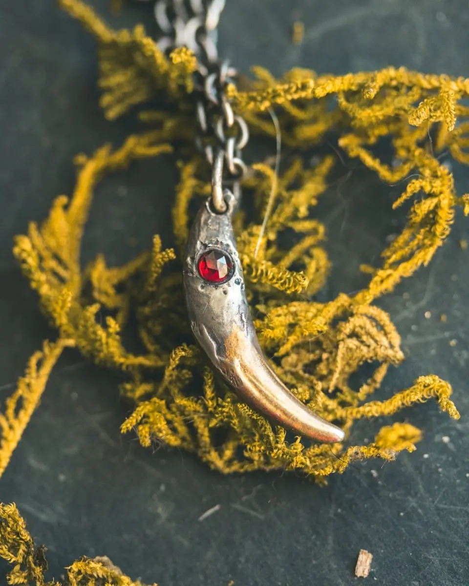 Fox Fang Pendant with Rose-Cut Almandine Garnet: A Symbol of Cunning, Passion, and Transformation