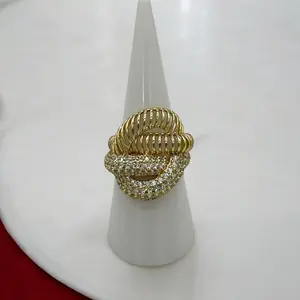 Luxury Ring with Gold Finish and Decorative Elements in a Unique Design