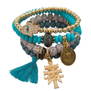 turquoise blue bracelet with hamsa hand, Cruz de Caravaca and San Benito medall