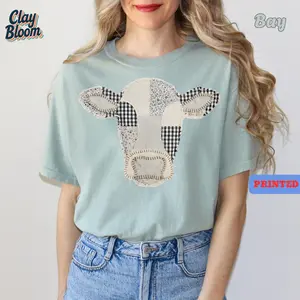 Comfort Colors Patchwork Cow T-Shirt | Cute Quilted Cow Graphic Tee for Women | Vintage Cottagecore Farmhouse Style Shirt | Aesthetic Animal Lover Gift | Soft Oversized Relaxed Fit Cotton Top | Trendy Western Boho Apparel | Blue Jean Color - By Clay Bloom
