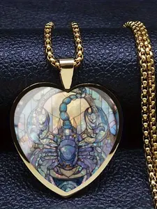 A transparent glass heart-shaped necklace with a 2D glass-style scorpion pattern inside.