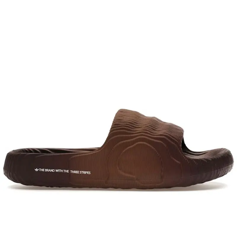 adidas Adilette 22 Slides Preloved Brown Lifestyle Slip-On Sandals EVA Foam Construction Lightweight Comfort Slides Textured 3D Design Earth Tone Brown Colorway Shower Pool Beach Slides Quick Dry Durable Adidas Summer Recovery Slide Footwear
