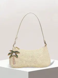 A niche design seaside vacation style woven armpit bag with coconut tree pendant decoration, fashionable retro simple casual versatile texture single shoulder bag, suitable for commuting and shopping.