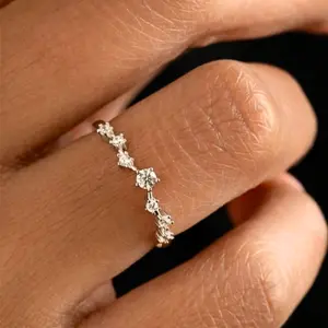 A minimalist ring set with 7 round Cubic Zirconia stones, suitable for women to wear daily, as an engagement gift, wedding gift, or holiday gift.