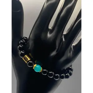 Aquarius Zodiac black obsidian with aquamarine chalcedony semi precious stone/crystal elastic beaded bracelet with gold accents