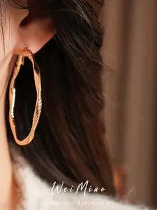 Elegant Hollow Twist Earrings, High-End Light Luxury Design, Simple Yet Fashionable Ear Studs, Exaggerated Statement Jewelry