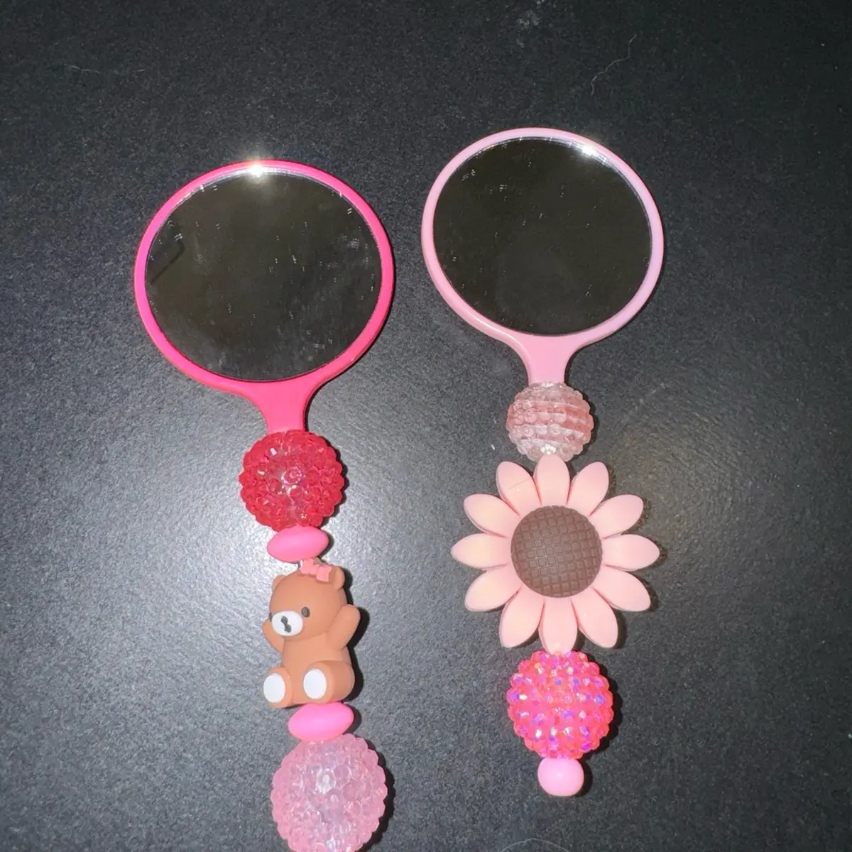 Handheld beaded mirror