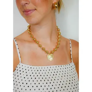 Accented Crystal Heart Necklace with Charms, Beaded Design, Gold Finish, and Broken Glass Elements