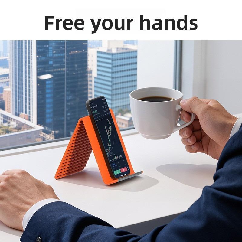 Multifunctional silicone folding mobile phone stand – ideal for frequent users of digital devices. Suitable for use on office desks, in the kitchen for following recipes, for portable storage whilst travelling, and as a non-slip mount in the car.