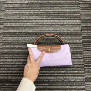 Pre-owned Longchamp As Shown Tote Bags This is a Le Pliage Original travel bag in light purple nylon with brown leather trim13450