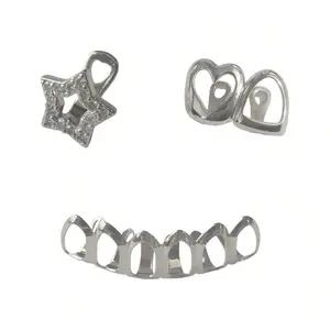 Bottom open-face silver grillz paired with a top single-tooth star and heart grillz. Made with durable silver-plated metal, they come with adjustable molding bars for a secure, comfortable fit on most teeth sizes.