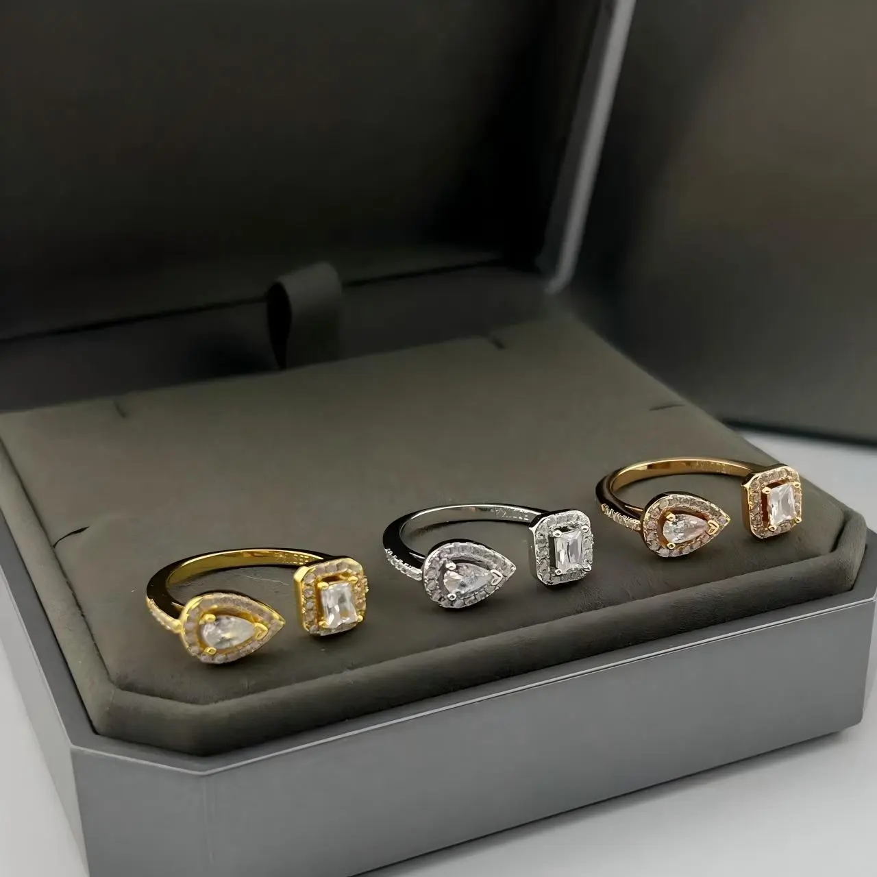 An elegant multi-colored diamond-set drop-shaped square ring, exuding charm and making an excellent gift choice.