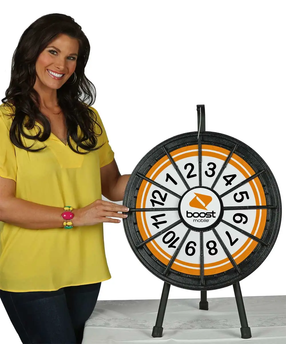 Prize Wheel – Fully Customizable! Add your logo, images and prizes to create a branded experience. Boost engagement at trade shows, events & stores. Durable, eye-catching, made in the USA. Customize yours today!