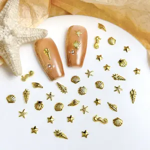 10g Mini Gold Ocean Series Nail Charms 3D Multiple Style Creative Alloy Shell Starfish Conch Seahorse Thin Flakes Nail Art Decorations for DIY Nail Art