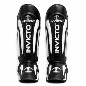 Invicto Sports MMA Shin & Instep Guards, Rexine Leather Construction, Multi-Layer EVA Padding, Adjustable Velcro Strap, Black & White, for Training & Sparring