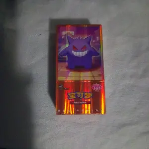 Pokemon Chinese Booster Box Volume 3 Featuring Central Figure & Circular Motif Collectible Figurine