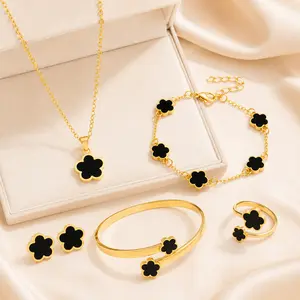 Elegant Gold-Plated Four-Leaf Clover Jewelry Set – Necklace, Bracelet, Ring & Earrings with Black Enamel Inlay – Trendy Lucky Charm Accessory for Women