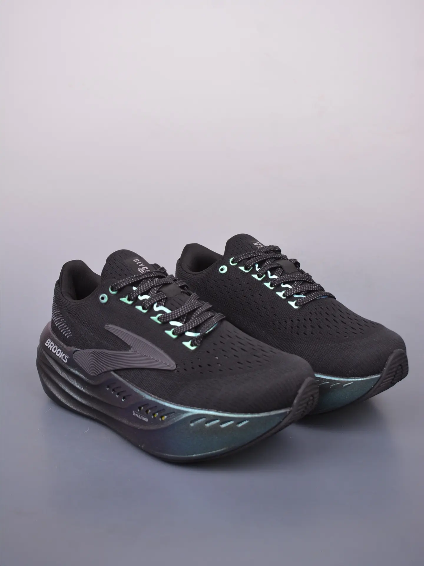 Iridescent hologram cushioned outsole sport shoe black woven knit upper vented toe box low profile lace running trainer shock absorbent athletic footwear