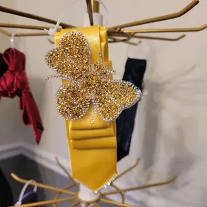 Yellow tie with a bee patch