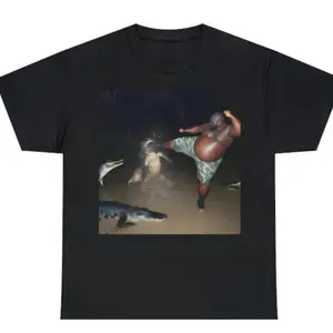 Humorous Unisex TShirt Featuring Man Kicking Alligator in Swamp Perfect for Meme Lovers and Available in Sizes Small to Three XL