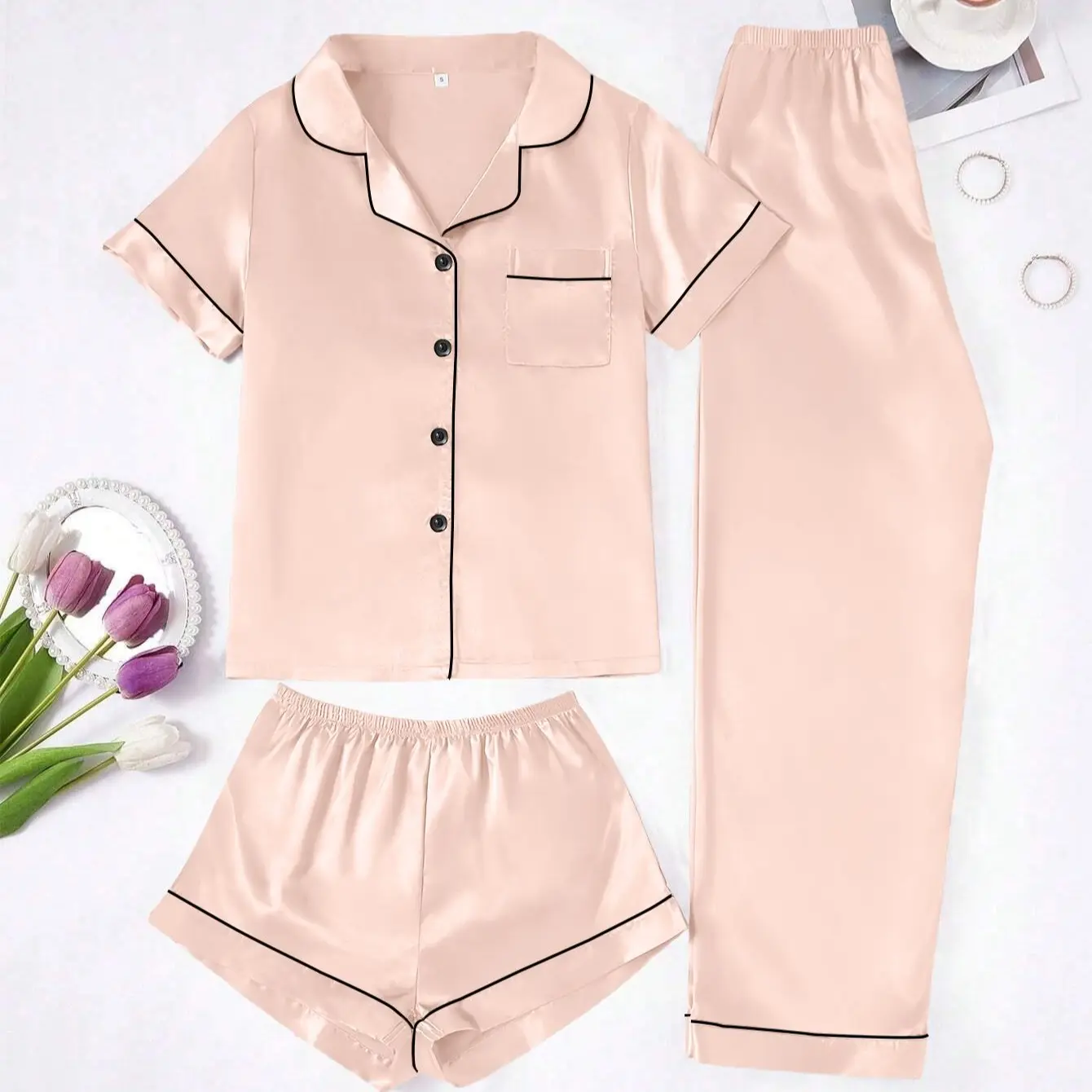 Indulge in ultimate comfort with this women's 3-piece solid color pajama set. It includes a collared short-sleeve top, elastic waist shorts and long pants. Soft, lightweight and breathable, perfect for daily lounging and peaceful sleep.