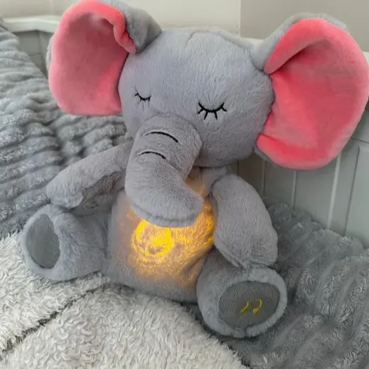 Snuggies Breathing Elephant Plushie - Original Soft Calming Light Heartbeat  Music with Realistic Breathing Function Vibration and Heartbeat Sounds for  Restful Sleep - TikTok Shop