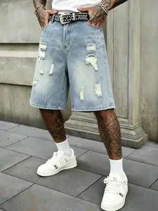Men’s ripped loose denim shorts, Y2K hip-hop street style, patch appliqué details, wide-leg denim shorts, vintage black wash, knee-length, casual skateboarding shorts, unisex denim apparel. Menswear