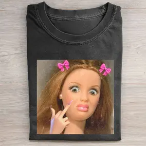 Barbie Doll Pointing Middle Finger Attitude Meme Graphic T-Shirt, Sassy Barbiecore Funny Parody Expression, Y2K Doll Aesthetic Pop Culture Streetwear Tee Unisex Cotton Crewneck T-Shirt Menswear Womenswear Streetwear Top