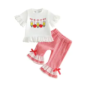 Toddler girls’ school uniform set featuring a short-sleeve top with pencil pattern paired with plaid flared pants—summer back-to-school outfit
