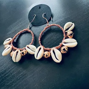 Copper cowrie shells and bells hoop earrings