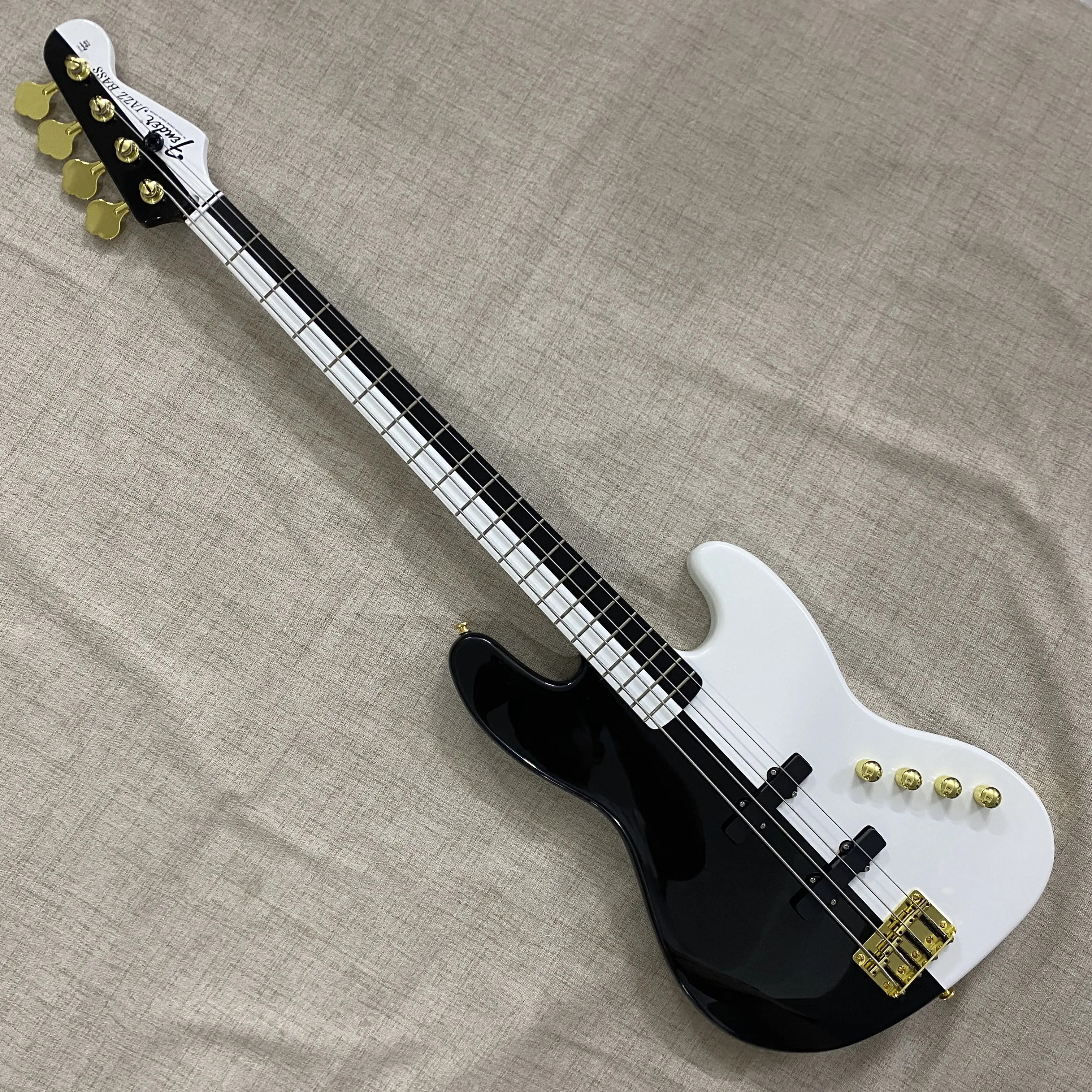 4-String Black & White Split Color PJ Bass Guitar with Mahogany Body, Gold Tuners, Gold Knobs, and Gloss Finish