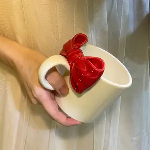 Large Coffee Mug — A charming ceramic mug designed specifically for women, featuring an exquisite decorative bow accent. Dishwasher and microwave safe. An ideal gift choice.