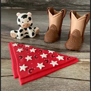 Fondant Boots, bandana, and cow cake topper.