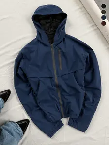 Everyday casual navy blue hooded aviator jacket featuring a single zippered chest pocket and an adjustable drawstring hood, made from wrinkle-resistant woven fabric—ideal for grabbing coffee in the morning and strolling around after breakfast.