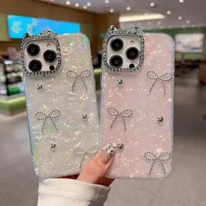 This cat ear heart-shaped shell pattern phone case is compatible with iPhone 17 Pro Max/iPhone 16/15Pro/14/1311 models. It features a bow and metal ball decoration, making it both cute and exquisite.